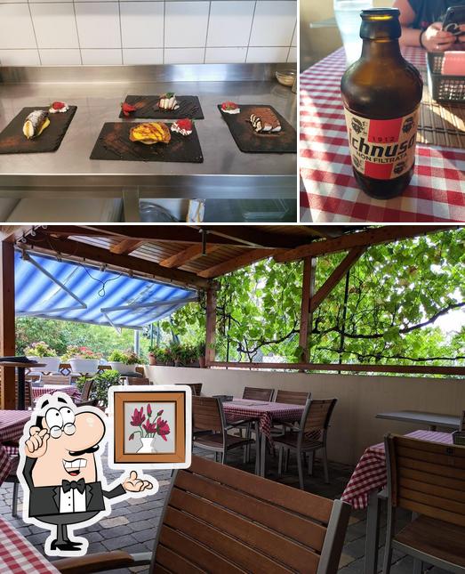 The image of Pizzeria Sardegna La Rosa Blu’s interior and beer
