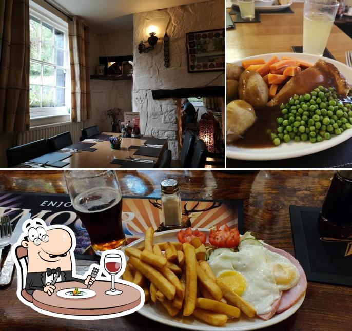 The image of food and dining table at The Foresters Arms Dunster