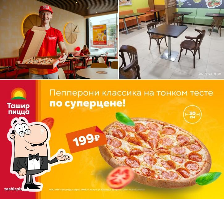 Las imágenes de interior y pizza en Tashir Pizza