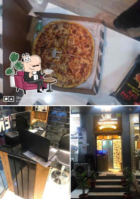 Take a look at the photo displaying interior and pizza at Telephonic Pizza