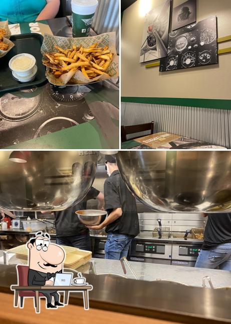 Take a look at the photo depicting interior and food at Wingstop