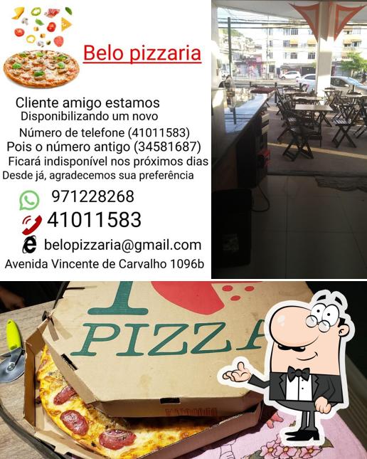 O interior do belo pizzaria Vila da Penha