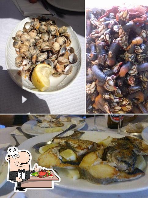 Попробуйте блюда с морепродуктами в "Puerto Arnela"