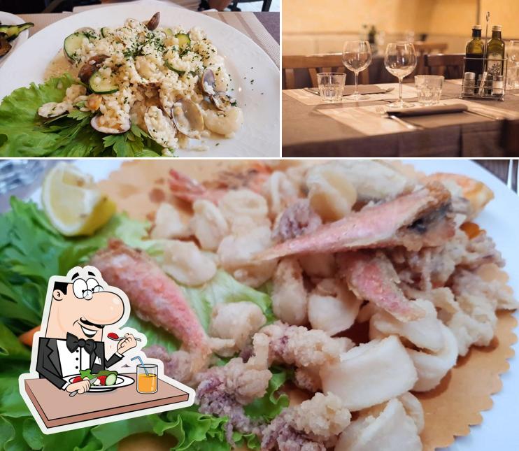 Trattoria Al Pescatore si caratterizza per la cibo e interni