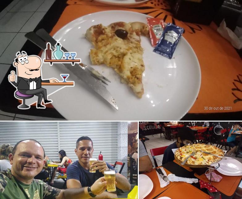 Entre diversos coisas, interior e comida podem ser encontrados no Pizzaria Toque do Cheff