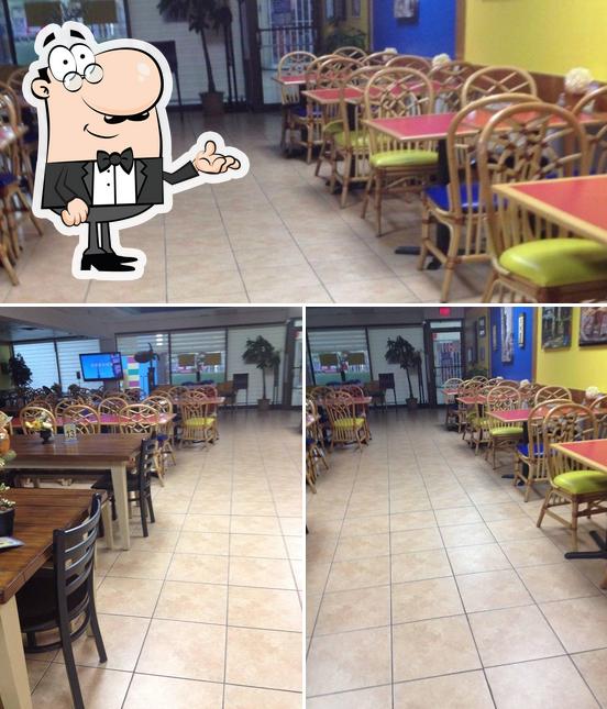 Take a seat at one of the tables at Lunchbox Cafe and Catering by Regina
