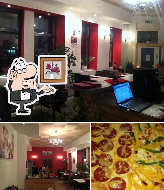 Los interior y pizza del restaurante