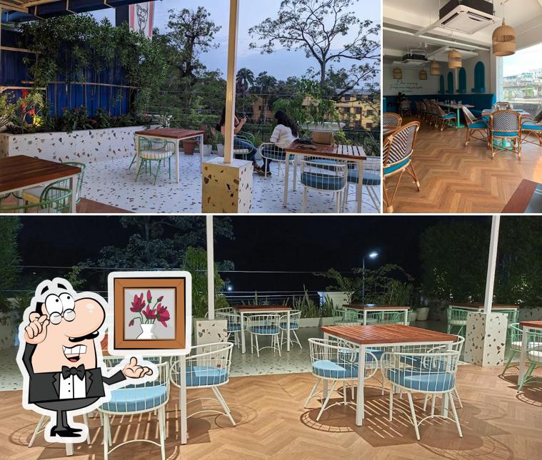 Take a seat at one of the tables at OHANA - Cafe Kitchen & Terraces