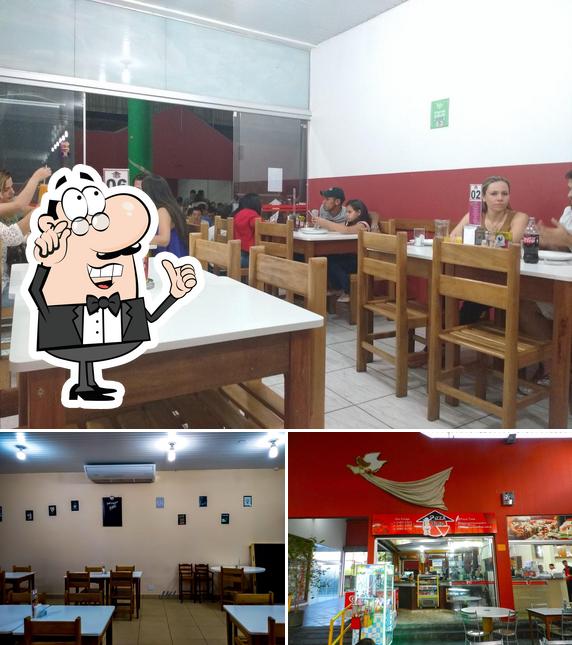 O interior do Pizzaria Time Oficial