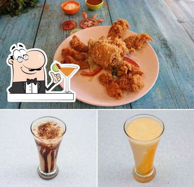 The photo of drink and food at CRAVY WINGS (The American Diner)