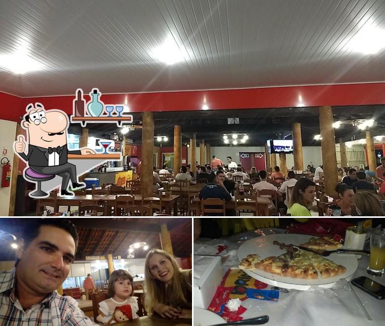 Entre diversos coisas, interior e pizza podem ser encontrados a D'talia Pizzaria e Choperia