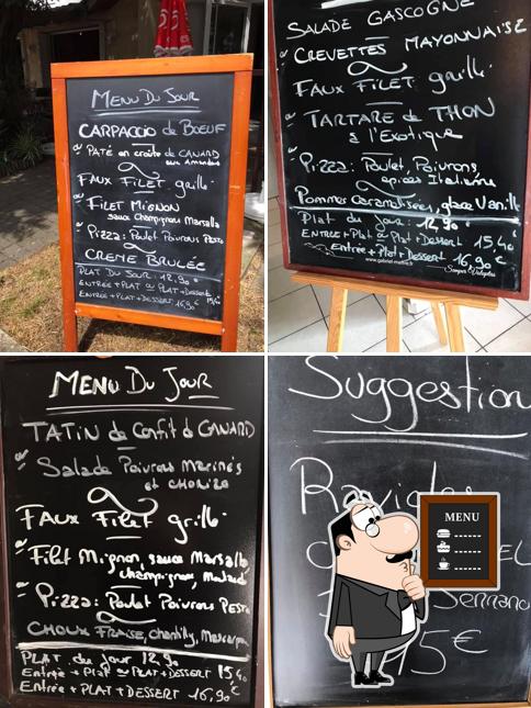 Ô Comptoir - Restaurant Caviste présente un tableau affichant le menu