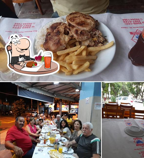 Dê uma olhada a foto apresentando mesa de jantar e comida a Restaurante Caçador Praça Afonso Pena