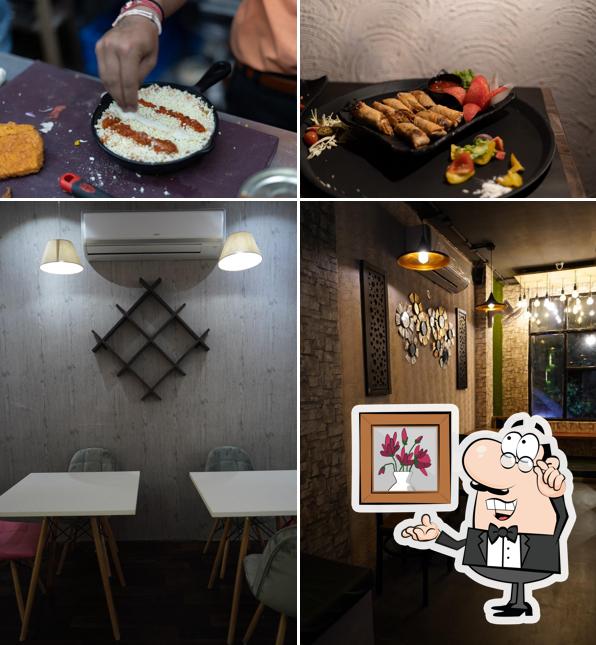 Take a seat at one of the tables at The Aura Cafe