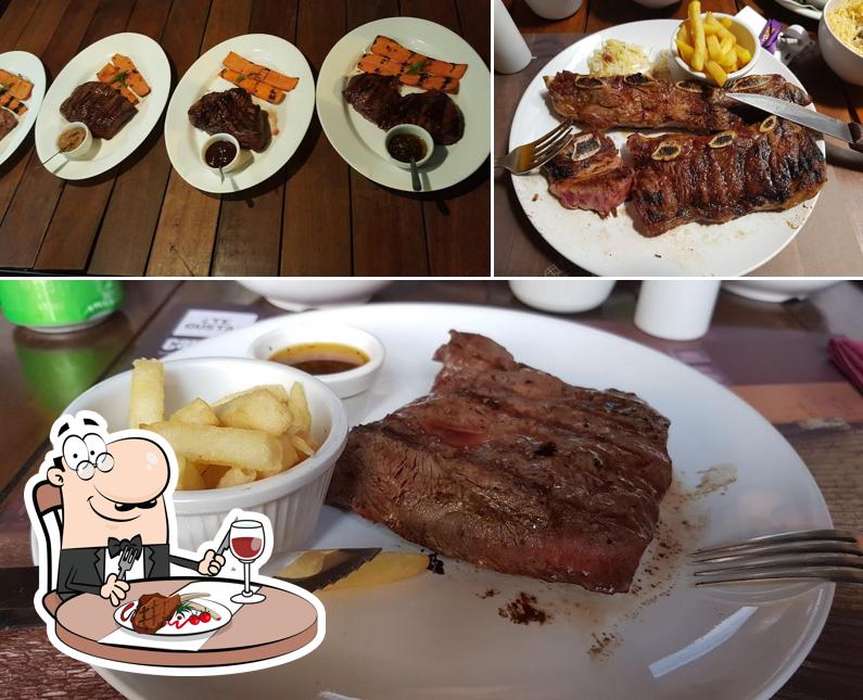 Peça refeições de carne no Calle 54