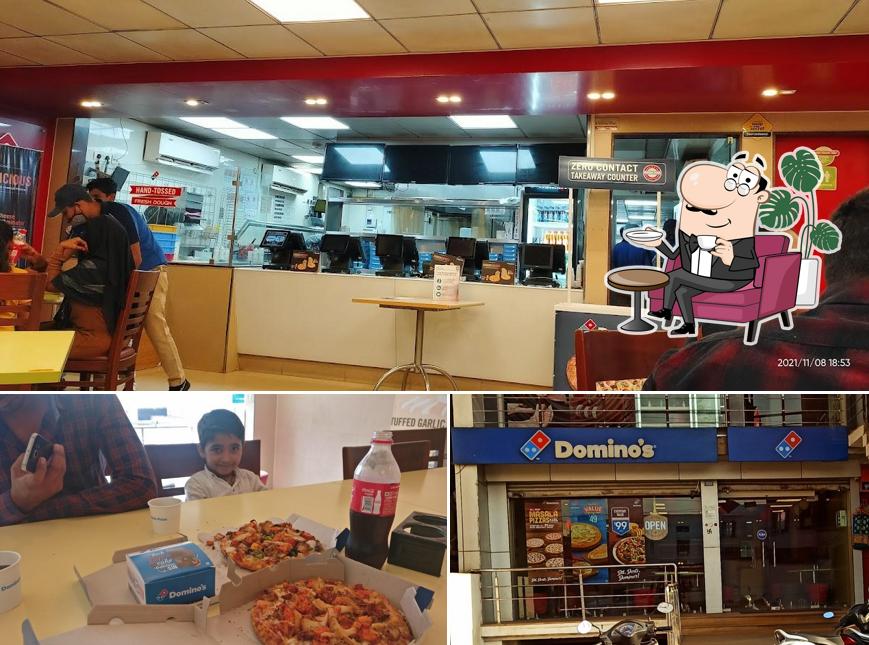 This is the picture depicting interior and food at Domino's Pizza Amdi Mandir, Durg