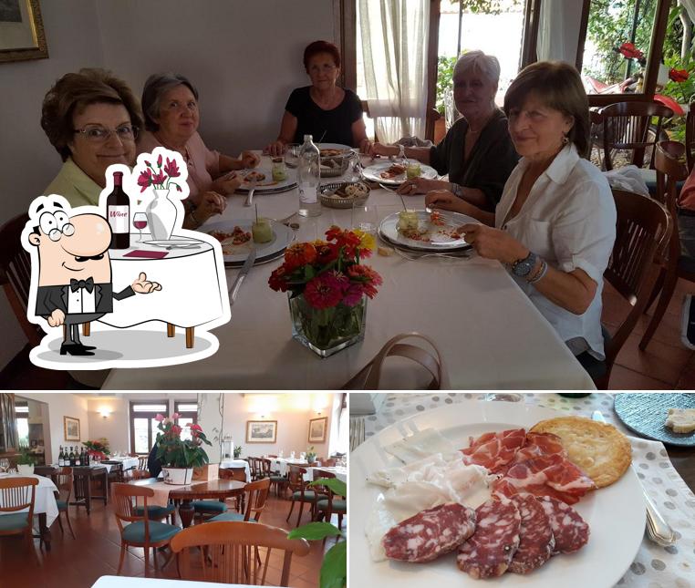 Questa è la foto che presenta la tavolo da pranzo e cibo di Albergo Ristorante Selvatico