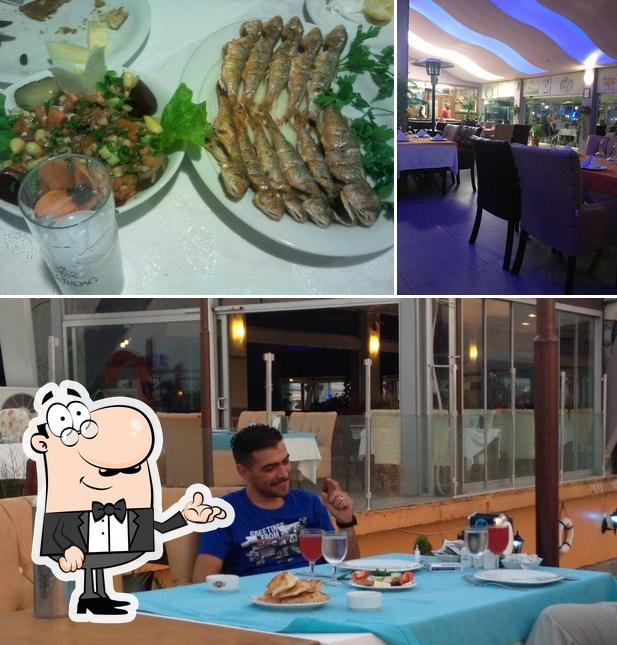 Among different things one can find interior and seafood at Karadeniz Balık Restaurant