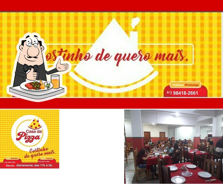 Esta é a imagem mostrando comida e interior a Casa Da Pizza