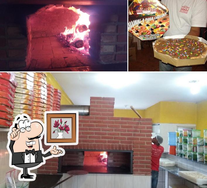 Esta é a foto apresentando interior e comida no Casa das Esfihas e Pizzaria Di Napoli