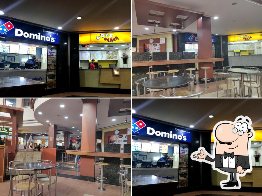 Take a seat at one of the tables at Domino's Pizza Uchana, karnal