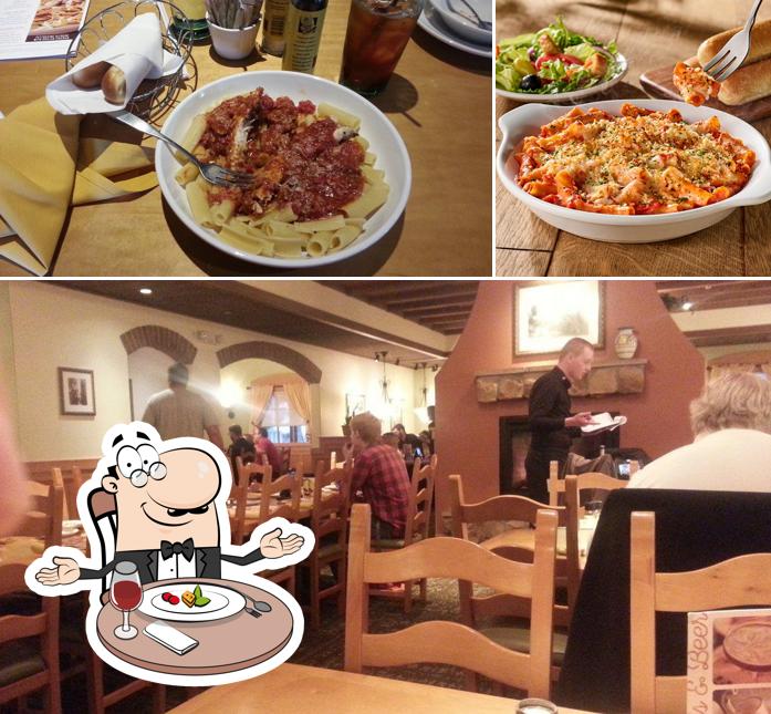 Olive Garden Italian Restaurant is distinguished by dining table and food