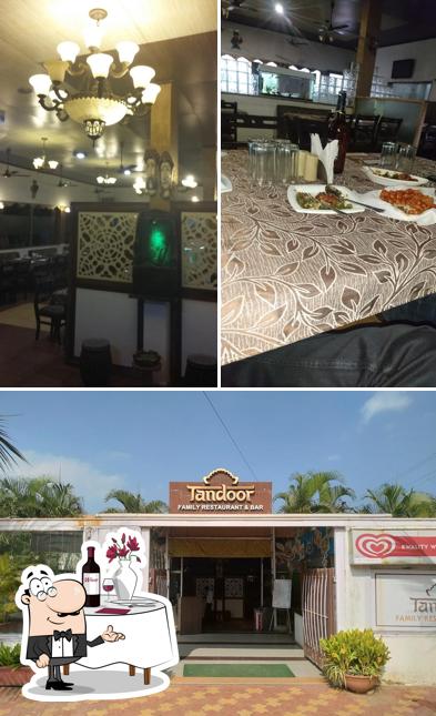 This is the image showing dining table and exterior at Tandoor Family Restaurant