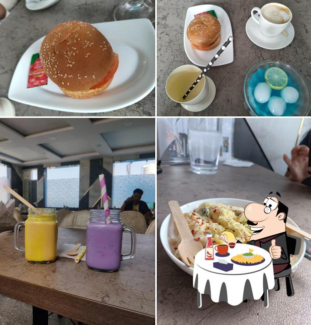 Order a burger at Tropical Cafe & Creamery