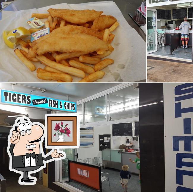 Check out the image showing interior and fries at Tigers Fish & Chips