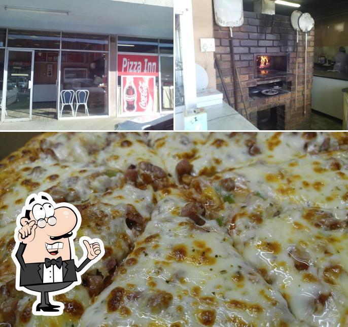 Las fotos de interior y pizza en AJ's Roadhouse & Take Aways