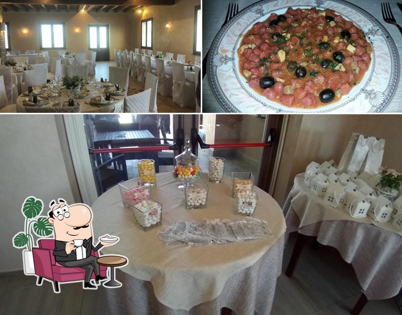 La immagine di interni e pizza da Ristorante Gomedo