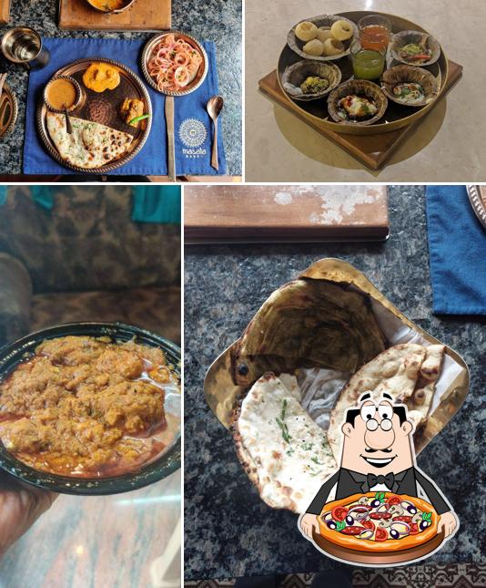 Try out pizza at MASALA MANDI