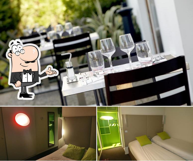 Installez-vous à l'une des tables de Hôtel Restaurant Campanile Versailles - Buc