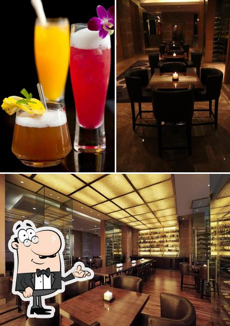 Take a look at the image showing interior and beverage at The Bar