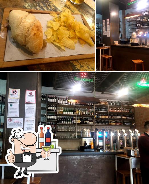 Among various things one can find bar counter and food at Cerveceria Altrastero