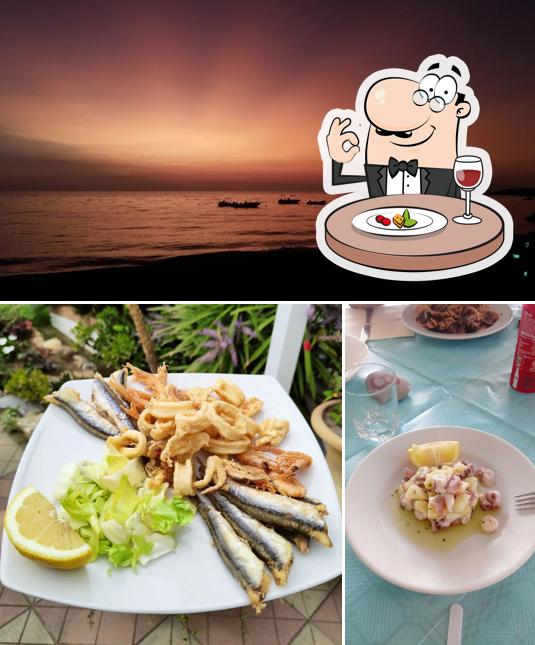 Dai un’occhiata alla foto che raffigura la cibo e esterno di Boa Bar Beach
