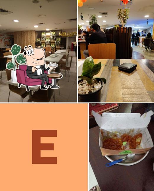 Take a seat at one of the tables at Evergreen Restaurant & Sweet House