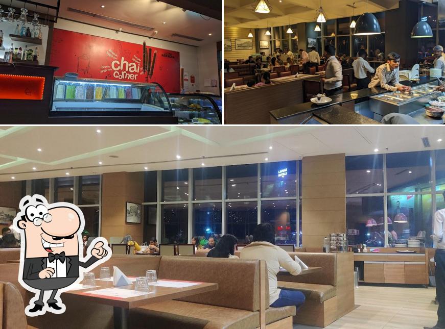 Take a seat at one of the tables at Paragon Restaurant Lulu mall kochi