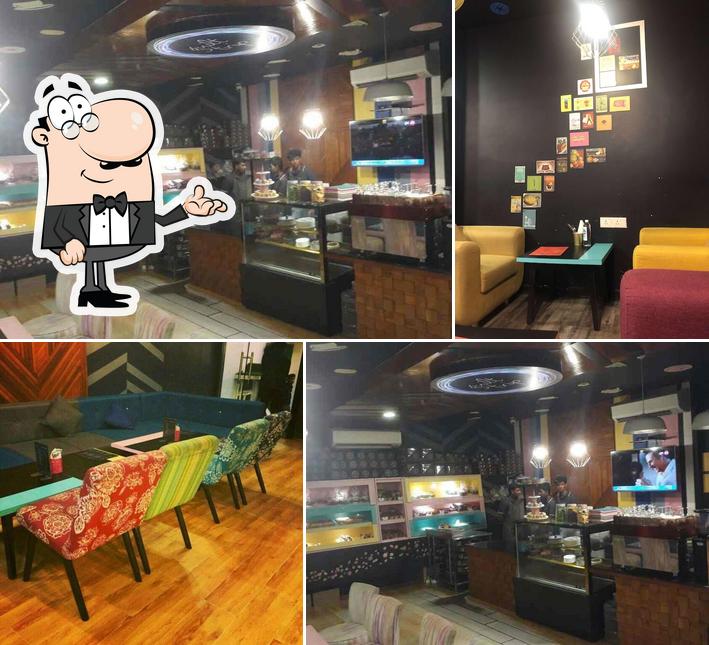 Take a seat at one of the tables at Ghrelin Cafe and Patisserie - Banjara Hills