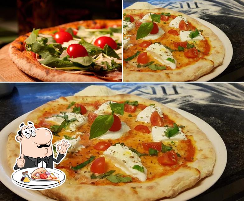 Scegli una pizza a Restaurant des XIII Cantons