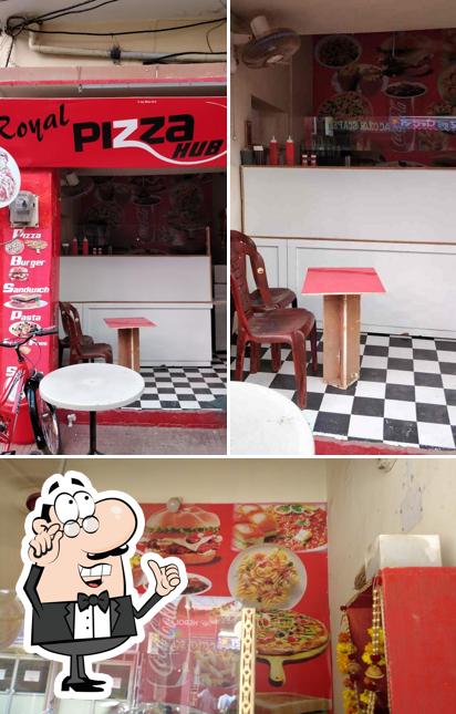 This is the photo showing interior and burger at Royal Pizza Hub