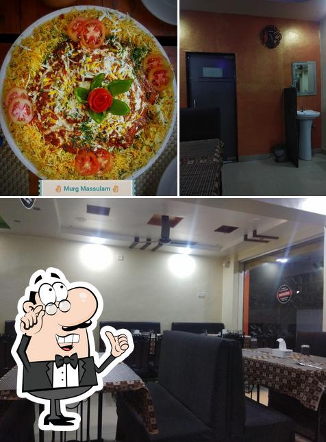 This is the image displaying interior and pizza at girija resto and bar,Tanish Family Restaurant