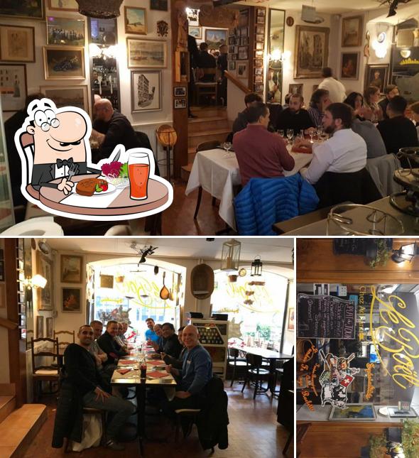 Parmi les diverses choses de la table à manger et la tableau noir, une personne peut trouver sur Restaurant Le Boël « Chez Adriano »