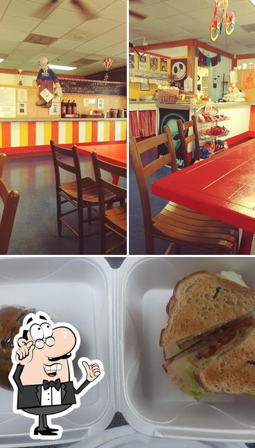 This is the image showing interior and sandwich at Picnics Cafe & Catering