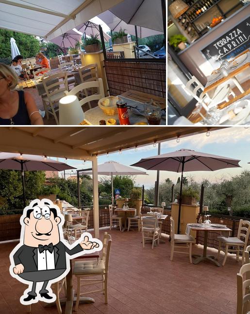 La immagine della interni e tavolo da pranzo di Terrazza Caprini Bistrot