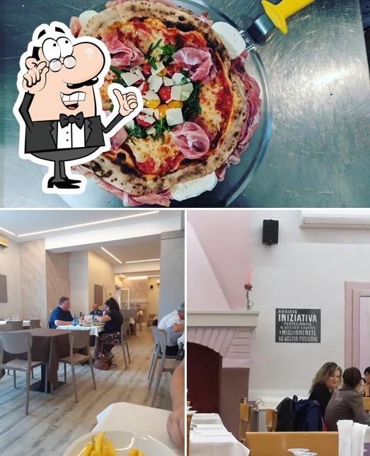 La foto di interni e pizza da Pizzeria DA AGO e Mery
