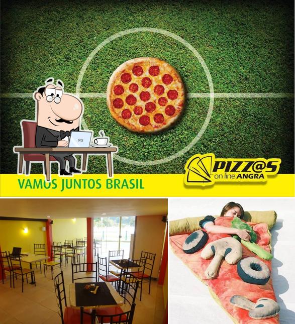 A foto da interior e exterior a Pizzas Online Angra