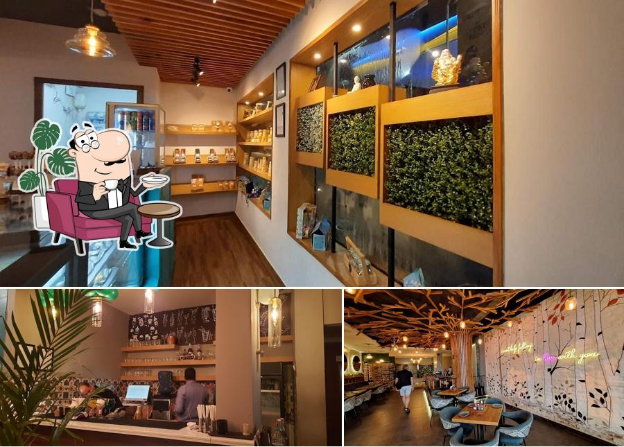 Take a seat at one of the tables at Eden Cafe Jhansi