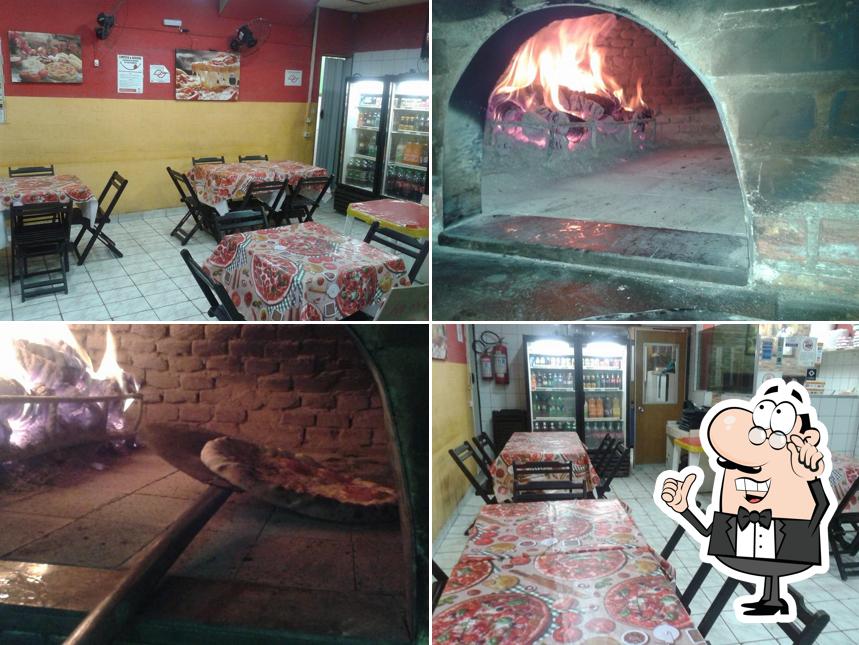 O interior do Pizzaria Nova Litoral LTDA