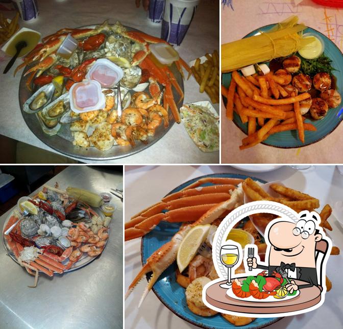 Order different seafood dishes served at Mad Crabber Restaurant